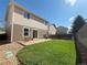 Backyard with patio, small garden, and lush green lawn, perfect for outdoor enjoyment at 10676 Forester Pl, Longmont, CO 80504