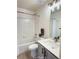 Hall bathroom featuring a shower-tub combo with modern fixtures and a stylish vanity with a quartz countertop at 10676 Forester Pl, Longmont, CO 80504
