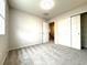Carpeted bedroom featuring neutral walls, closet with double doors, and lots of natural light at 10676 Forester Pl, Longmont, CO 80504