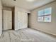 Cozy bedroom with carpet flooring, natural light, and closet with shelving space at 10676 Forester Pl, Longmont, CO 80504