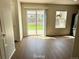 Dining area with hardwood floors and access to the backyard at 10676 Forester Pl, Longmont, CO 80504