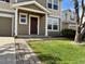 Charming home exterior with well-manicured lawn, inviting entrance and sidewalk at 10676 Forester Pl, Longmont, CO 80504