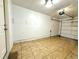 Spacious garage featuring tile flooring with ample room for parking at 10676 Forester Pl, Longmont, CO 80504