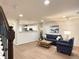 Comfortable living room with hardwood floors, neutral walls, and stylish furniture at 10676 Forester Pl, Longmont, CO 80504