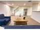 Bright living room showcasing an open-concept layout and hardwood floors at 10676 Forester Pl, Longmont, CO 80504