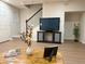 Modern living space with sleek furniture, wood floors, and an entertainment center, perfect for relaxation at 10676 Forester Pl, Longmont, CO 80504
