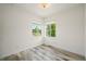 Well lit bedroom showcasing wood floors and a bright view from two sunny windows at 198 Starlight Cir, Erie, CO 80516