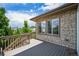 Open wooden deck with stone accents and views provides an excellent outdoor retreat at 198 Starlight Cir, Erie, CO 80516