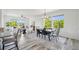 Bright dining area with large windows, modern decor, and open to the adjacent living space at 198 Starlight Cir, Erie, CO 80516