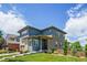 Stylish two-story home with a well-manicured lawn, stone accents and beautiful landscaping at 198 Starlight Cir, Erie, CO 80516