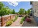 Charming front yard with stone pathway, flower beds, and a well-maintained lawn at 198 Starlight Cir, Erie, CO 80516