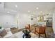 Open concept living area featuring wood floors and a modern kitchen with a center island at 198 Starlight Cir, Erie, CO 80516