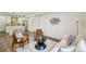 Spacious living room with stylish furniture, hardwood floors, and a view of the kitchen at 198 Starlight Cir, Erie, CO 80516