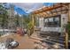 Backyard deck features outdoor seating and a wooden pergola, ideal for entertaining or relaxing outdoors at 846 Circle K Ranch Rd, Evergreen, CO 80439