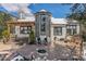 Backyard patio area with wood deck, exterior of home, mountain views, and outdoor furniture at 846 Circle K Ranch Rd, Evergreen, CO 80439