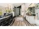 Bright bathroom with a glass block shower, double vanities, and marble finishes at 846 Circle K Ranch Rd, Evergreen, CO 80439