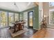 Bright dining area with mountain views, wood table, and access to the deck at 846 Circle K Ranch Rd, Evergreen, CO 80439