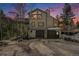 Stately home with a two-car garage nestled in a beautiful mountain setting at 846 Circle K Ranch Rd, Evergreen, CO 80439
