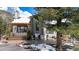 Stunning home with a covered deck and floor to ceiling windows at 846 Circle K Ranch Rd, Evergreen, CO 80439