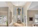 Bright entryway features tall windows, modern light fixture, and neutral decor for an inviting ambiance at 846 Circle K Ranch Rd, Evergreen, CO 80439