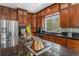 Spacious kitchen features modern appliances, dark countertops, and ample cabinet space at 846 Circle K Ranch Rd, Evergreen, CO 80439