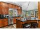 Well-equipped kitchen with stainless steel appliances, granite countertops, and wood cabinets at 846 Circle K Ranch Rd, Evergreen, CO 80439