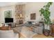 Charming living room features a stone fireplace, hardwood floors, and comfortable seating for a cozy atmosphere at 846 Circle K Ranch Rd, Evergreen, CO 80439