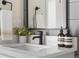Bathroom featuring matte black faucet, white countertop and backsplash at 1305 Osceola St, Denver, CO 80204