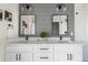 Contemporary bathroom featuring double sinks, modern lighting fixtures, and a clean design for a spa-like feel at 1305 Osceola St, Denver, CO 80204