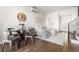Bright dining area with modern furniture and a nearby staircase at 1305 Osceola St, Denver, CO 80204