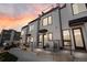 Exterior view of townhomes with modern architectural design, individual entryways, and appealing curb appeal at 1305 Osceola St, Denver, CO 80204