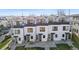 Aerial view of modern townhouses featuring clean lines, black window accents, and individual entryways at 1305 Osceola St, Denver, CO 80204