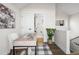 Bright home office featuring a sleek desk, stylish decor, and convenient access to an adjacent bathroom at 1305 Osceola St, Denver, CO 80204