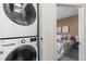 Efficient laundry area with stacked washer and dryer, conveniently located near the bedroom for easy access at 1305 Osceola St, Denver, CO 80204