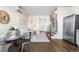 Cozy living room with hardwood floors, staircase, modern furniture and a round dining table at 1305 Osceola St, Denver, CO 80204