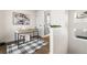 Well-lit office space showcasing a modern desk, stylish rug, and a serene atmosphere, perfect for productivity at 1305 Osceola St, Denver, CO 80204