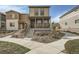 Charming two-story home featuring a covered porch and landscaped front yard at 12770 Tamarac St, Thornton, CO 80602