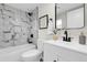Well-lit bathroom with modern fixtures, tiled shower, and sleek vanity at 8497 Madison Way, Denver, CO 80229