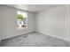 Bright bedroom with a large window offering ample natural light and a serene view at 8497 Madison Way, Denver, CO 80229
