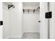 Walk-in closet with wood shelving, a hanging rod, and neutral decor ready for organization at 8497 Madison Way, Denver, CO 80229