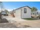 Charming single-story home with a well-manicured lawn, new concrete driveway, and appealing exterior paint at 8497 Madison Way, Denver, CO 80229