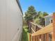 View of the side yard with wooden fence and some greenery at 8497 Madison Way, Denver, CO 80229