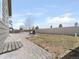 Large backyard with brick paver patio, perfect for outdoor living and enjoying the serene, spacious surroundings at 11060 River Oaks Ln, Commerce City, CO 80640