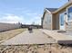 Spacious backyard featuring a brick patio, ideal for outdoor entertaining and relaxation in a private setting at 11060 River Oaks Ln, Commerce City, CO 80640