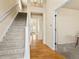 Bright and airy foyer with hardwood floors and an elegant staircase at 11060 River Oaks Ln, Commerce City, CO 80640