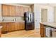 Well-equipped kitchen with stainless steel appliances and spacious wooden cabinetry at 11060 River Oaks Ln, Commerce City, CO 80640