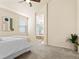 Relaxing main bedroom featuring neutral tones, soft carpet, and ensuite bathroom at 11060 River Oaks Ln, Commerce City, CO 80640
