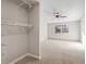 Bedroom with carpet, closet, ceiling fan, and a window for natural light at 765 S Alton Way # 6B, Denver, CO 80247