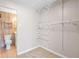 Walk-in closet with wire shelving and a view into the bathroom at 765 S Alton Way # 6B, Denver, CO 80247