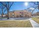 Two-story brick apartment building featuring a well-maintained lawn and sidewalk at 765 S Alton Way # 6B, Denver, CO 80247